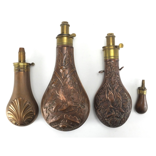 354 - Four Military interest copper and brass powder flasks, one embossed with game birds and foliage the ... 