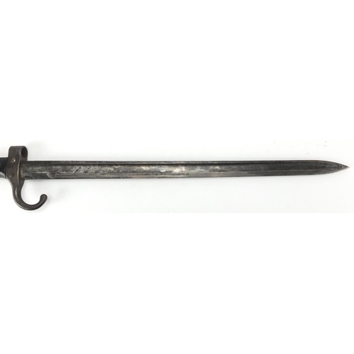 343 - Military interest bayonet and scabbard with triangular steel blade, various impressed marks, 56cm in... 