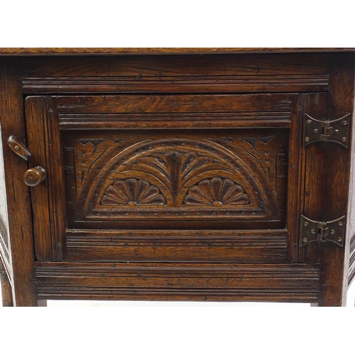 2021 - Ipswich oak credence cupboard with arcadian carved doors, 76cm high