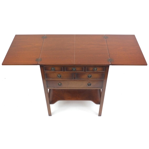 2009 - Mahogany serving table fitted with a folding top above a series of four drawers and an under tier, 8... 