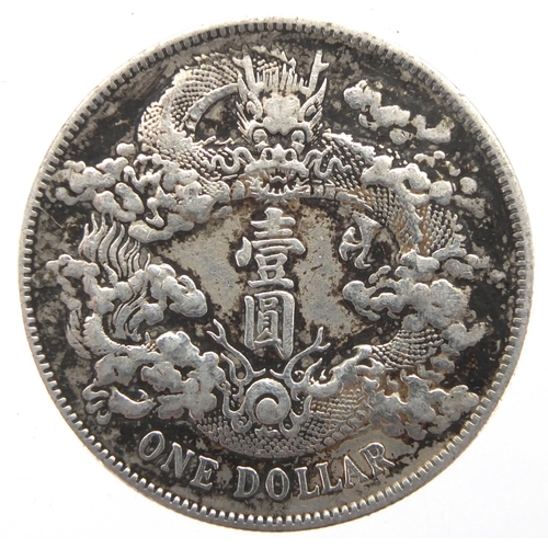 251 - Chinese silver one dollar, approximate weight 26.6g