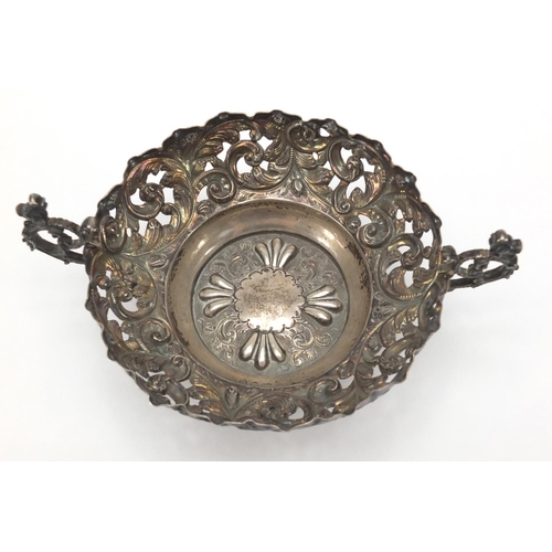 753 - Circular silver twin handle bon bon dish with embossed and pierced decoration, C. F London 1893, 11.... 