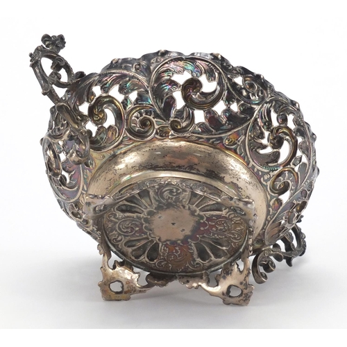 753 - Circular silver twin handle bon bon dish with embossed and pierced decoration, C. F London 1893, 11.... 