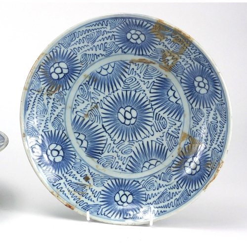 447 - Two Chinese blue and white porcelain dishes together with a similar basin, all hand painted with flo... 