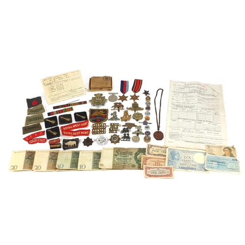 306 - British Militaria including World War II militaria including medal, cloth insignia, cap badges, silv... 