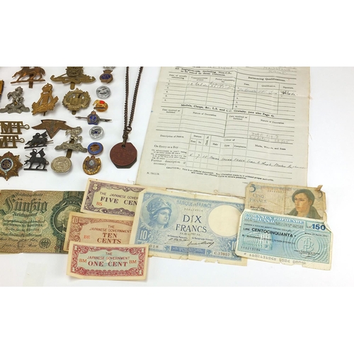 306 - British Militaria including World War II militaria including medal, cloth insignia, cap badges, silv... 