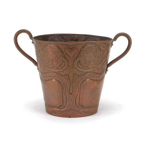 702 - Arts & Crafts copper ice bucket with twin handles, embossed with the tree of life, 16.5cm high