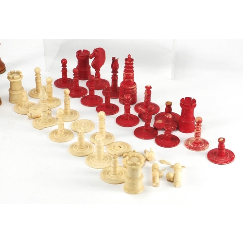 386 - Miscellaneous chess pieces including bone and boxwood examples, some stained, together with a draugh... 