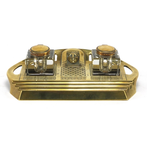 696 - German Art Nouveau Egyptian revival brass desk stand with two glass inkwells, stamped Geschutzt to t... 