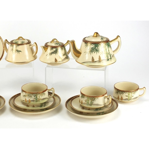 453 - Japanese Satsuma pottery teaware including teapot, lidded sugar and milk jug, the teapot 18cm in len... 