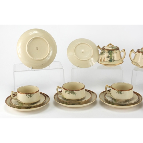 453 - Japanese Satsuma pottery teaware including teapot, lidded sugar and milk jug, the teapot 18cm in len... 