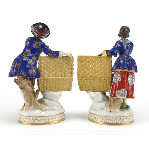 588 - Pair of 19th century hand painted continental porcelain figures of fruit sellers, both with factory ... 