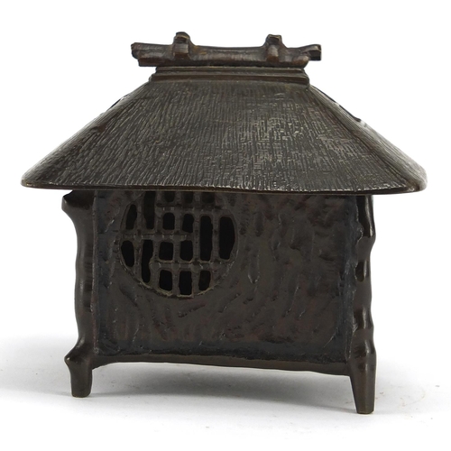 476 - Japanese bronze box and cover in the form of a hut, 9.5cm high