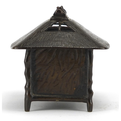 476 - Japanese bronze box and cover in the form of a hut, 9.5cm high