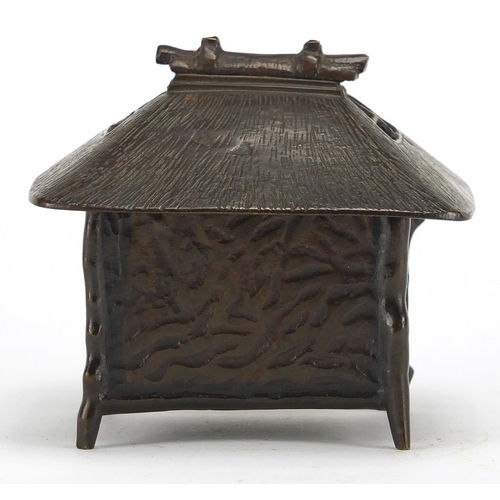 476 - Japanese bronze box and cover in the form of a hut, 9.5cm high