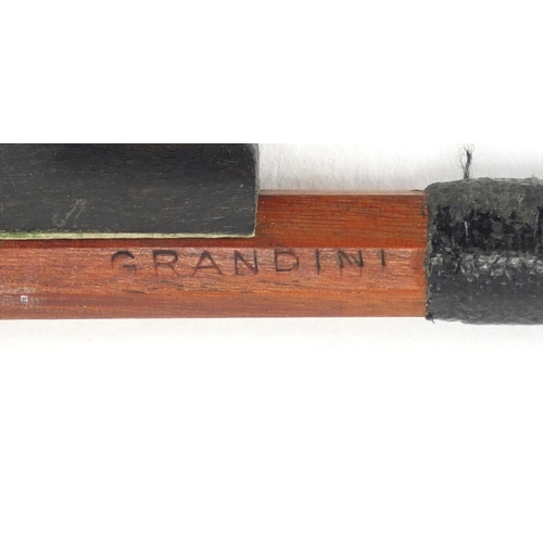 281 - Violin bow with Mother of pearl frog, impressed Grandino, 74cm in length, approximate weight 54.8g