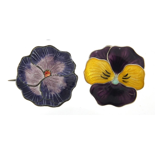 710 - Two silver and enamel flower head brooches together with a pair of silver and enamel earrings, one o... 