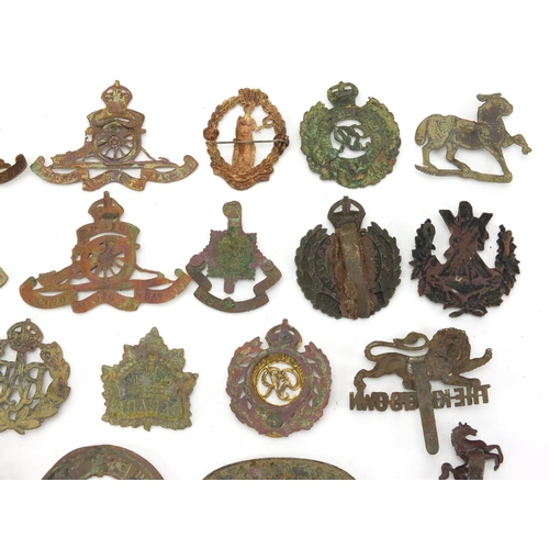 312 - Mostly British Military interest cap badges and buttons including Royal Sussex and Royal Engineers