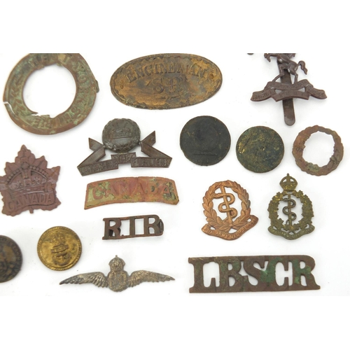 312 - Mostly British Military interest cap badges and buttons including Royal Sussex and Royal Engineers