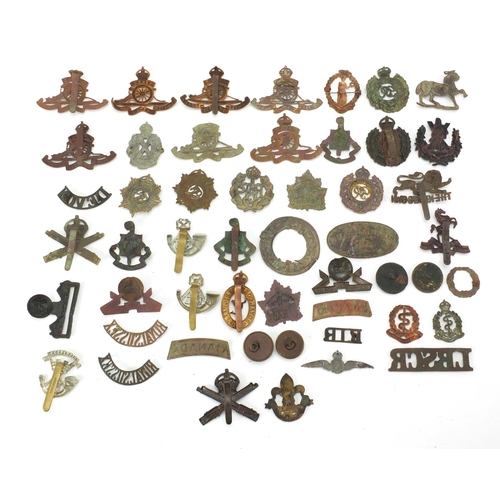 312 - Mostly British Military interest cap badges and buttons including Royal Sussex and Royal Engineers