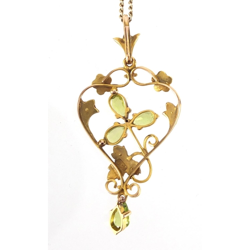 818 - 9ct gold Art Nouveau Peridot and seed pearl pendant, with 9ct gold necklace, the pendant 4.5cm in le... 