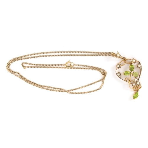 818 - 9ct gold Art Nouveau Peridot and seed pearl pendant, with 9ct gold necklace, the pendant 4.5cm in le... 