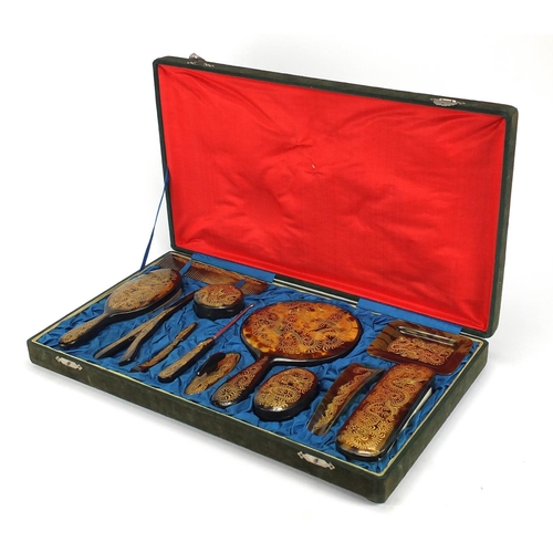 2042 - Oriental faux tortoiseshell twelve piece dressing table set, decorated with dragons including a hand... 
