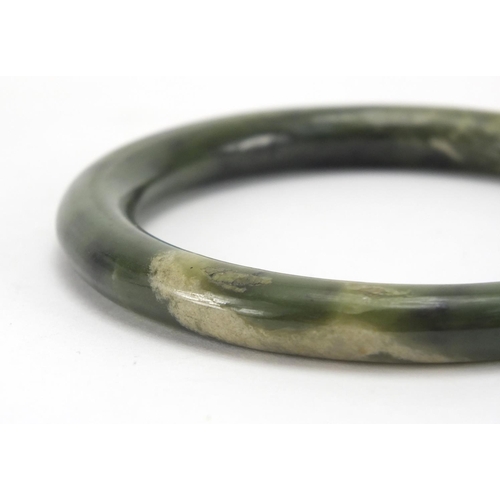 496 - Five Chinese spinach green jade bangles, each approximately 7.9cm in diameter, approximate weight 19... 