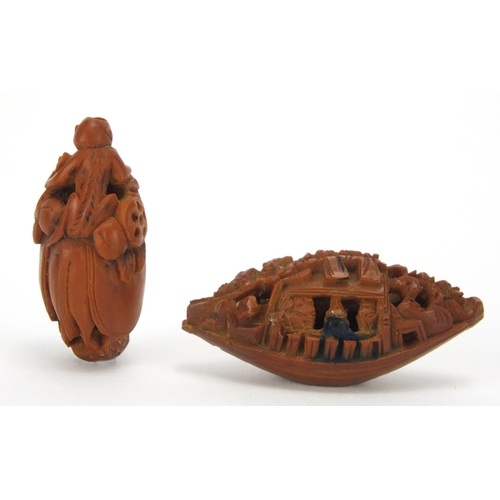 500 - Two Chinese coquilla nuts, one carved in the form of a junk the other of a monkey and horse, the lar... 