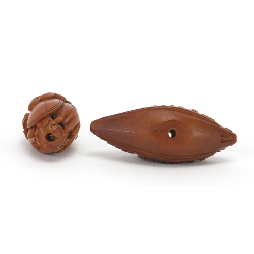 500 - Two Chinese coquilla nuts, one carved in the form of a junk the other of a monkey and horse, the lar... 