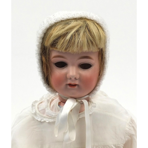 389 - Large Armand Marseille bisque headed doll with composite limbs, wearing a white lace dress, 80cm in ... 