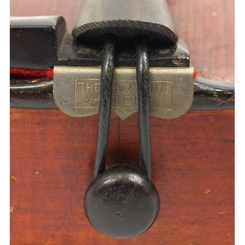 277 - Old wooden violin with scrolled neck, bearing a Mordoch & Co of London label to the interior, the vi... 