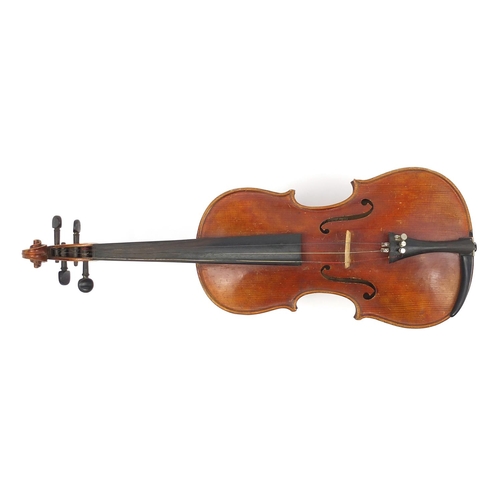 277 - Old wooden violin with scrolled neck, bearing a Mordoch & Co of London label to the interior, the vi... 