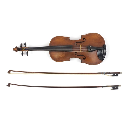 276 - Old wooden violin with one piece back and scrolled neck, together with two unnamed violin bows and f... 