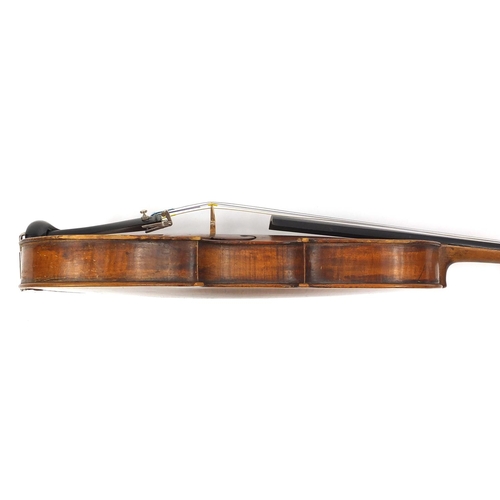 276 - Old wooden violin with one piece back and scrolled neck, together with two unnamed violin bows and f... 