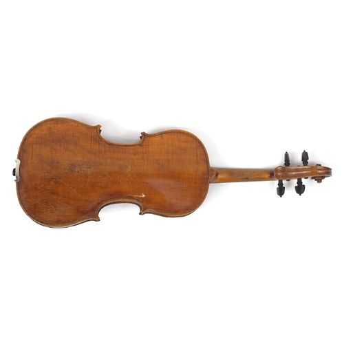 276 - Old wooden violin with one piece back and scrolled neck, together with two unnamed violin bows and f... 