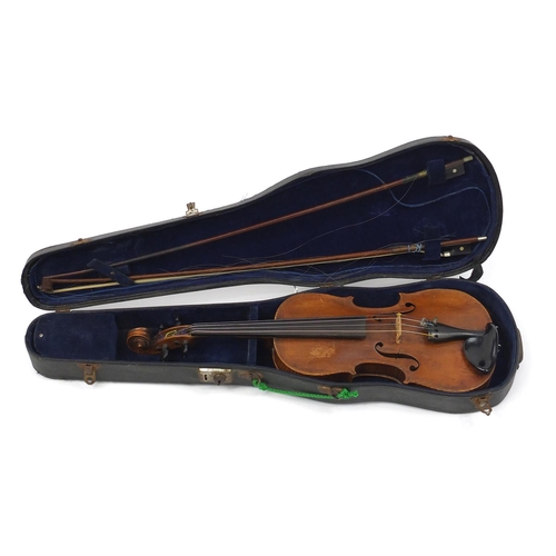 276 - Old wooden violin with one piece back and scrolled neck, together with two unnamed violin bows and f... 