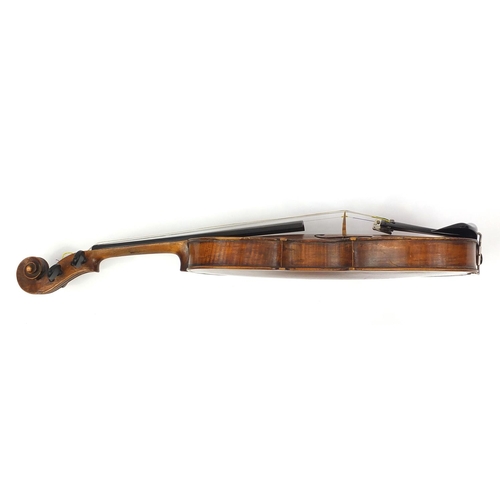 276 - Old wooden violin with one piece back and scrolled neck, together with two unnamed violin bows and f... 