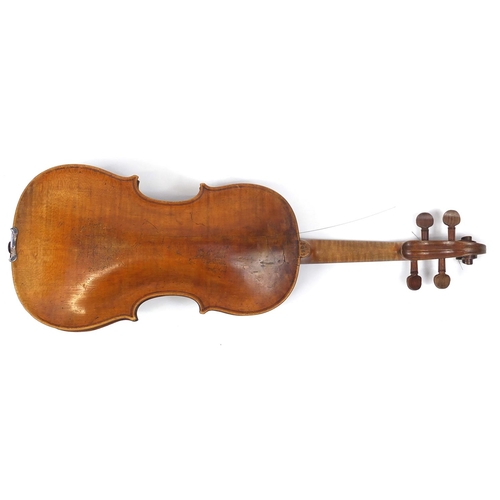 274 - Old wooden violin with one piece back and scrolled neck, with fitted hardwood carrying case, the vio... 