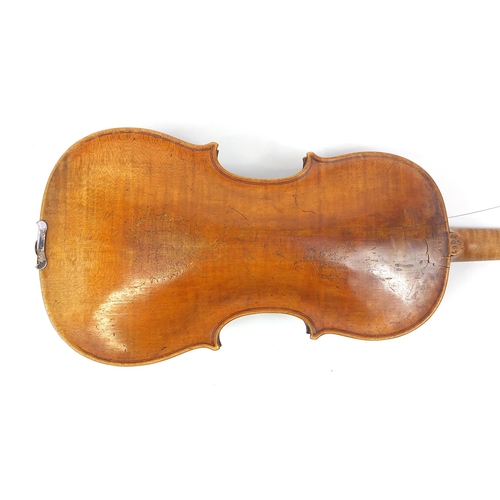 274 - Old wooden violin with one piece back and scrolled neck, with fitted hardwood carrying case, the vio... 