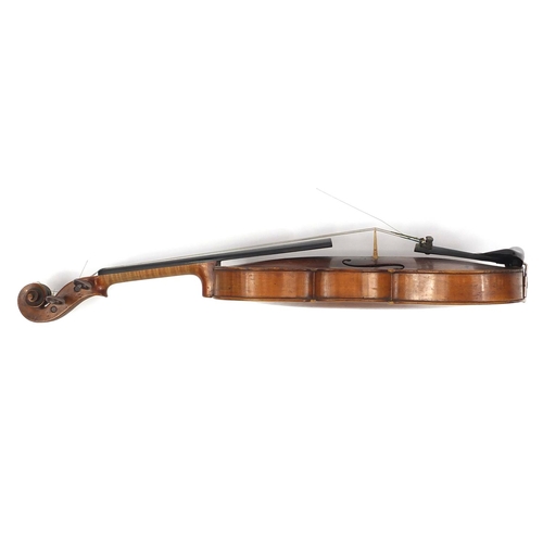 274 - Old wooden violin with one piece back and scrolled neck, with fitted hardwood carrying case, the vio... 