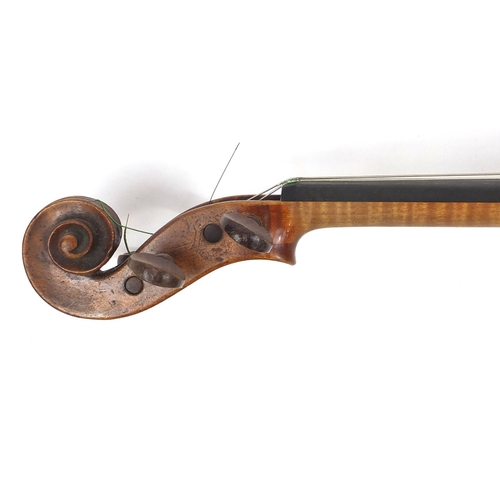 274 - Old wooden violin with one piece back and scrolled neck, with fitted hardwood carrying case, the vio... 