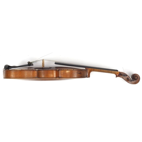 274 - Old wooden violin with one piece back and scrolled neck, with fitted hardwood carrying case, the vio... 