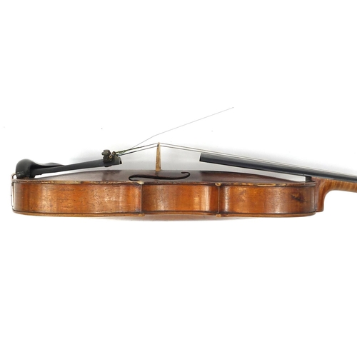 274 - Old wooden violin with one piece back and scrolled neck, with fitted hardwood carrying case, the vio... 