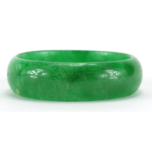 493 - Chinese green jade bangle, 8cm in diameter