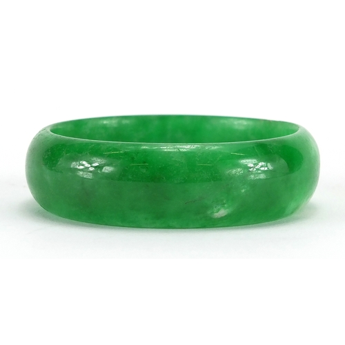 493 - Chinese green jade bangle, 8cm in diameter