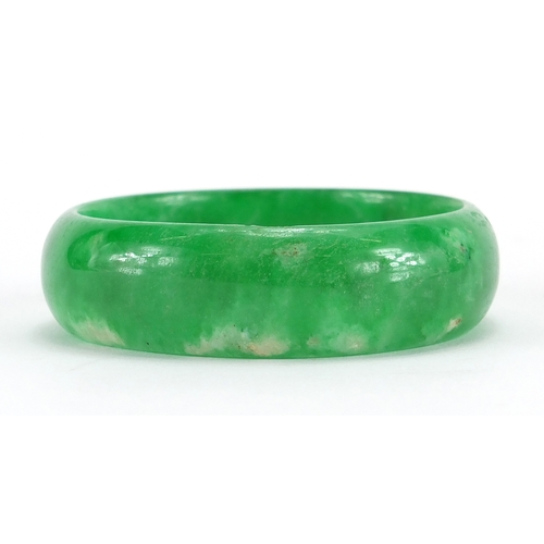 493 - Chinese green jade bangle, 8cm in diameter