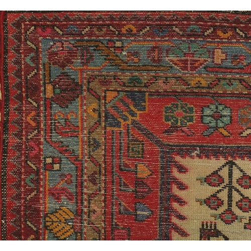 2025 - Rectangular Persian tribal rug, having an all over geometric desgin onto a red ground, 135cm x 135cm
