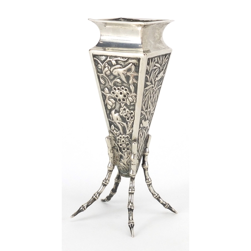 524 - Chinese silver vase of square tapering form with simulated bamboo legs, embossed with birds of parad... 