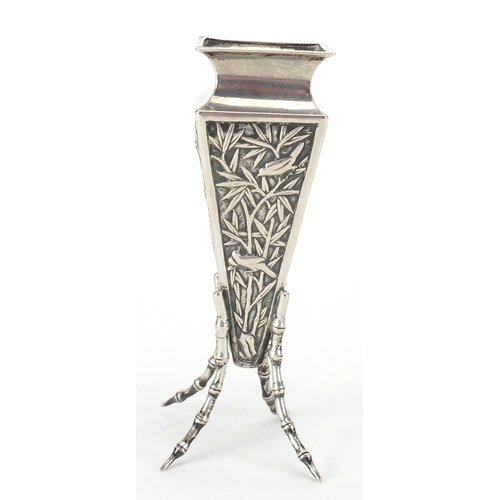 524 - Chinese silver vase of square tapering form with simulated bamboo legs, embossed with birds of parad... 